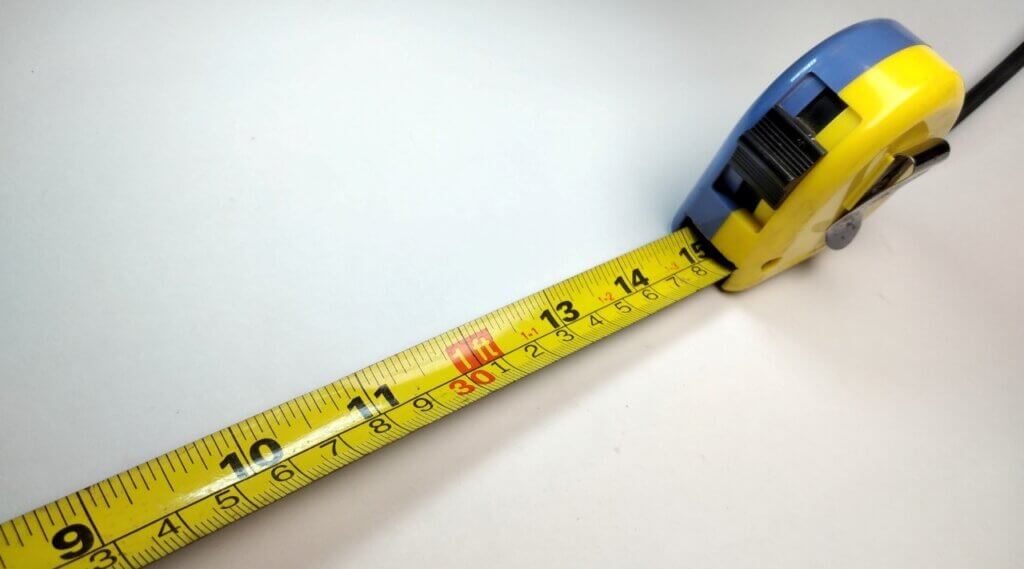 close up shot of a tape measure on a white background