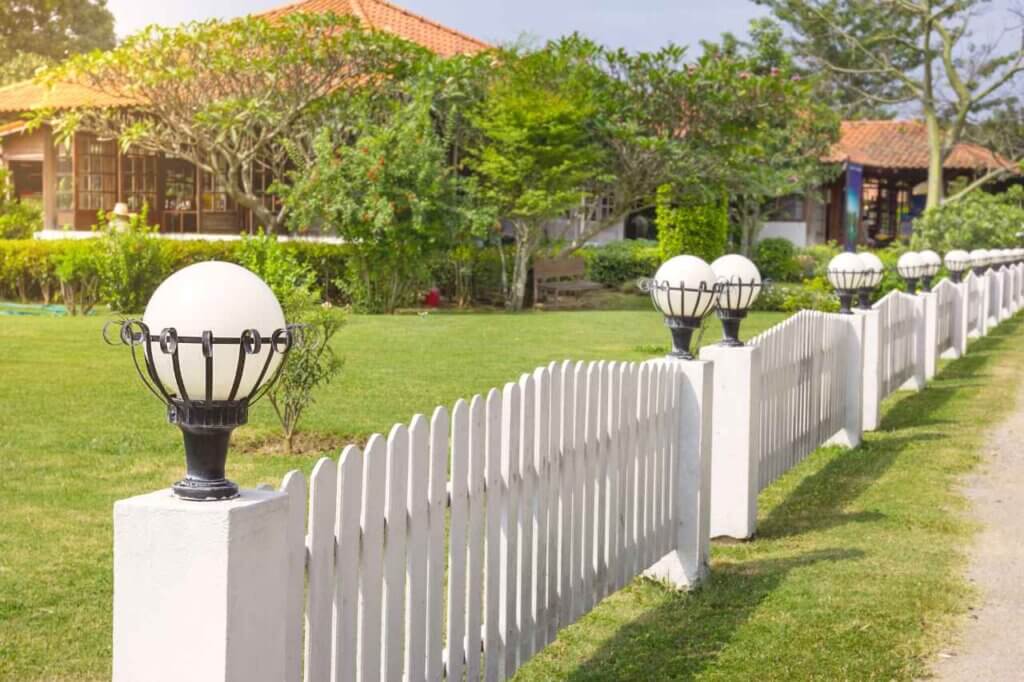 beautiful white fence with lamps