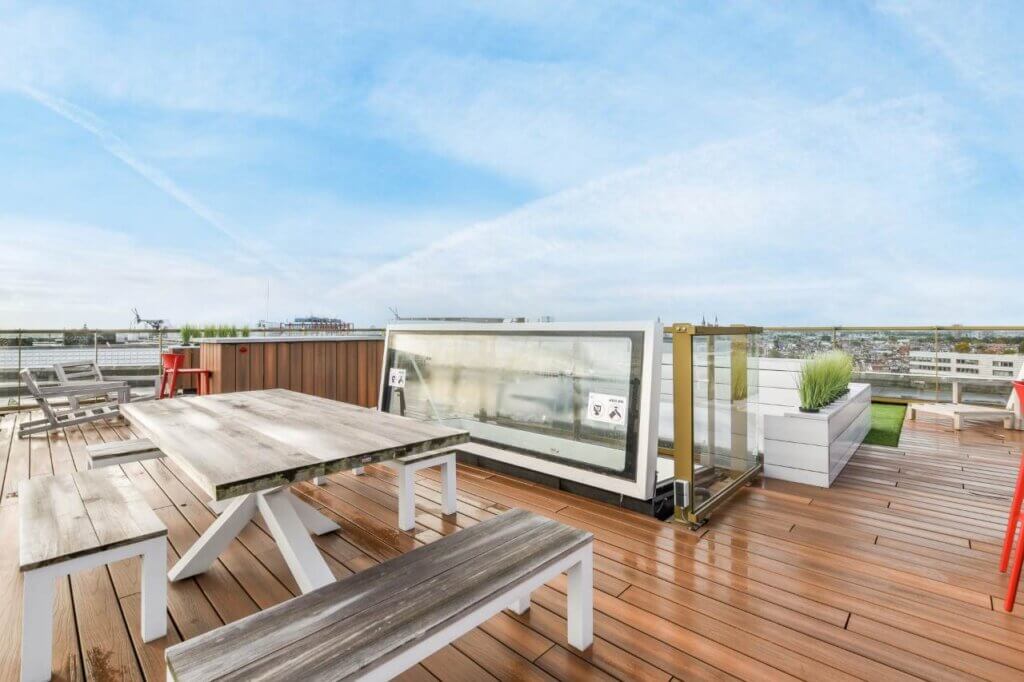 wooden decking with table and bench