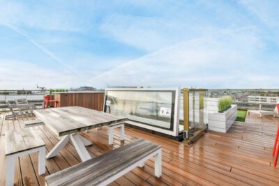 wooden decking with table and bench