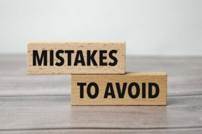 words mistakes to avoid printed on wooden blocks