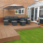 composite decking design in garden, teak / amber