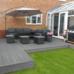 composite decking design in garden, grey / ash