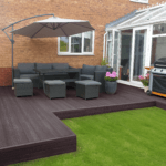 composite decking design in garden, brown / mocha