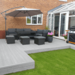 composite decking design in garden, light grey / stone