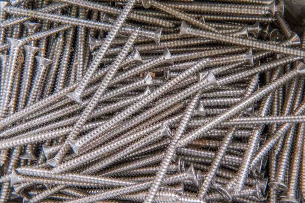 long screws piled up