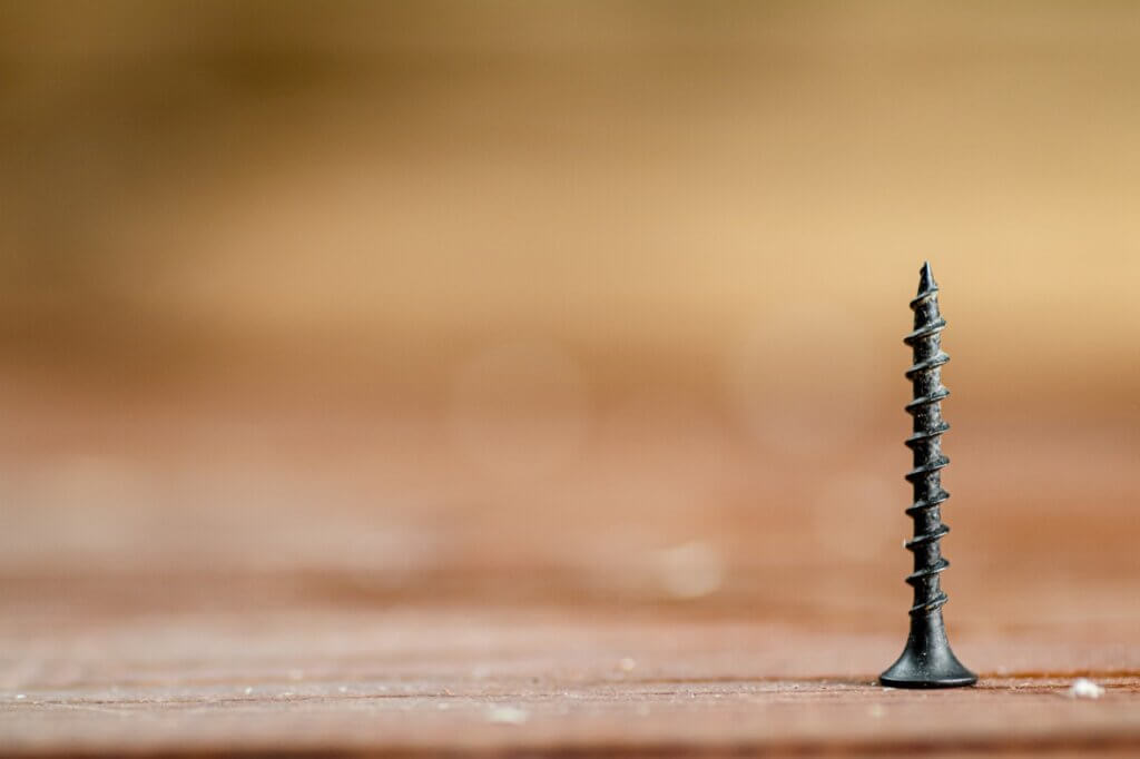 screw on a wooden table