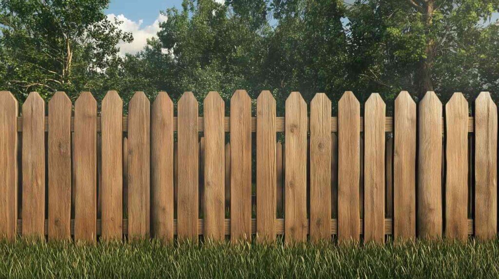 wooden fence with green grass