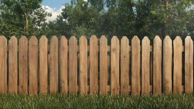 wooden fence with green grass