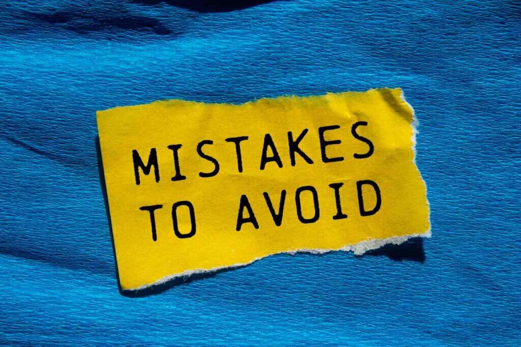 mistakes to avoid written on a piece of yellow paper