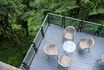 beautiful gray composite deck with coffee table and chairs