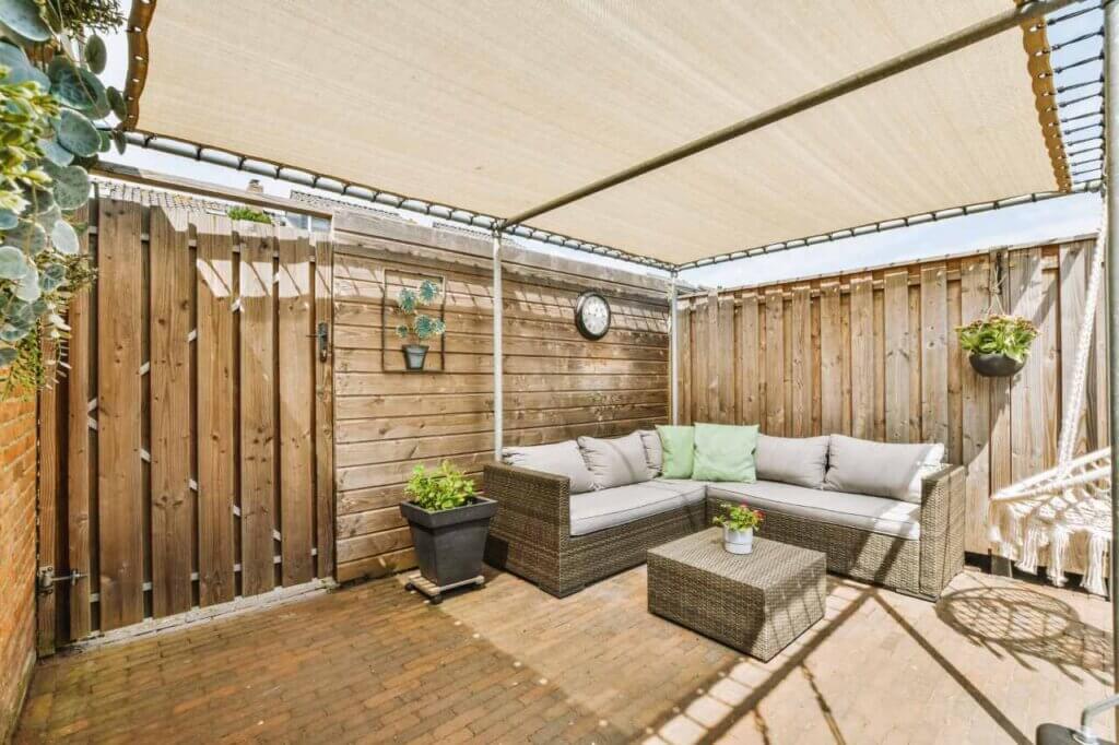 A wooden deck with a white canopy