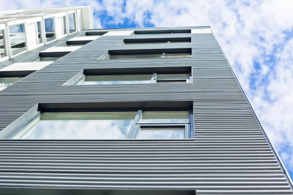 modern home with metal cladding installed on exterior