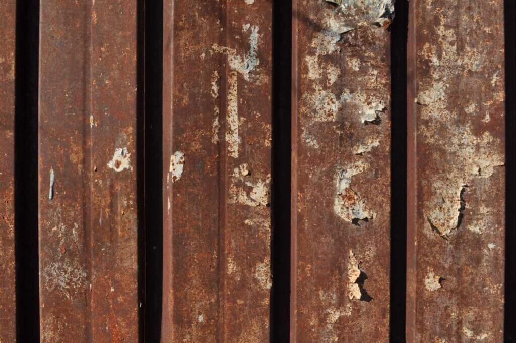 brown rusted steel fencing